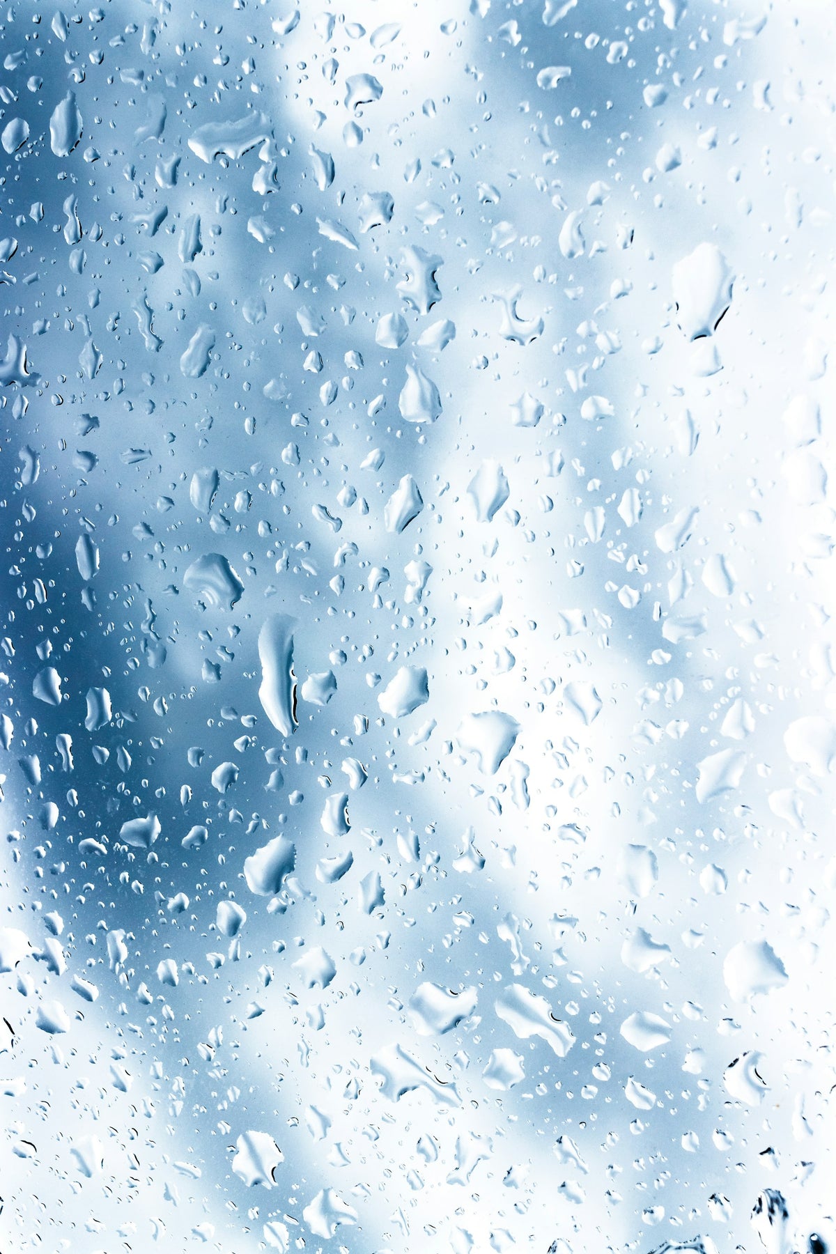 Water droplets beading on glass